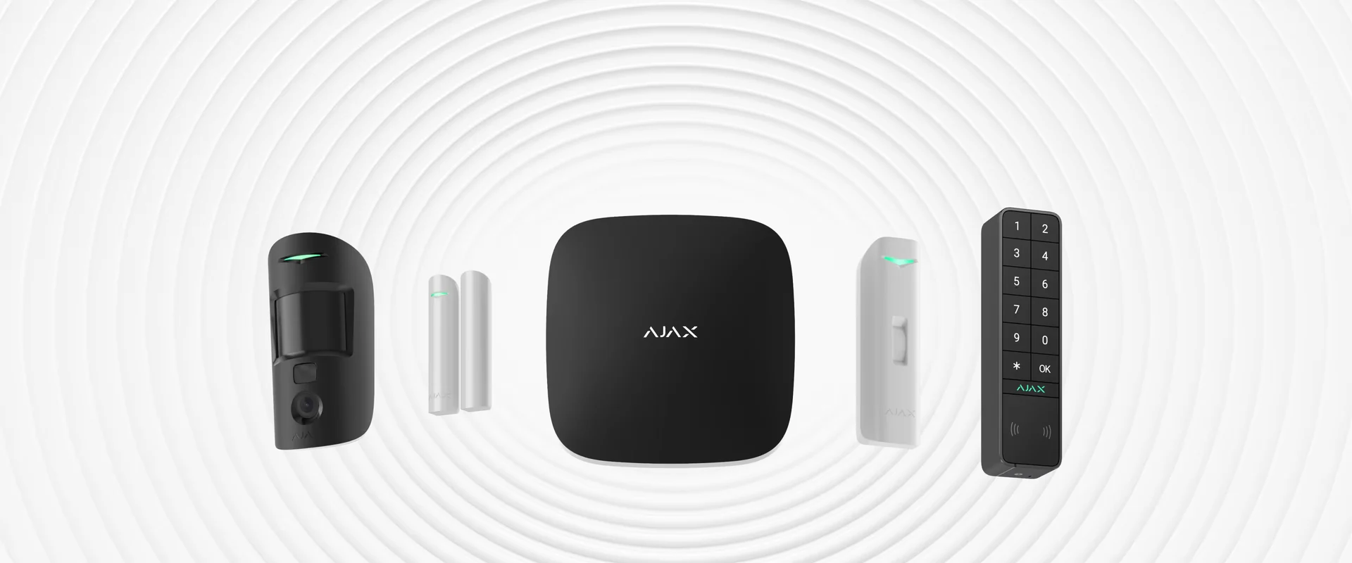 Ajax Systems Baseline wireless alarm range showing a hub, motion detector, door detectors and keypad